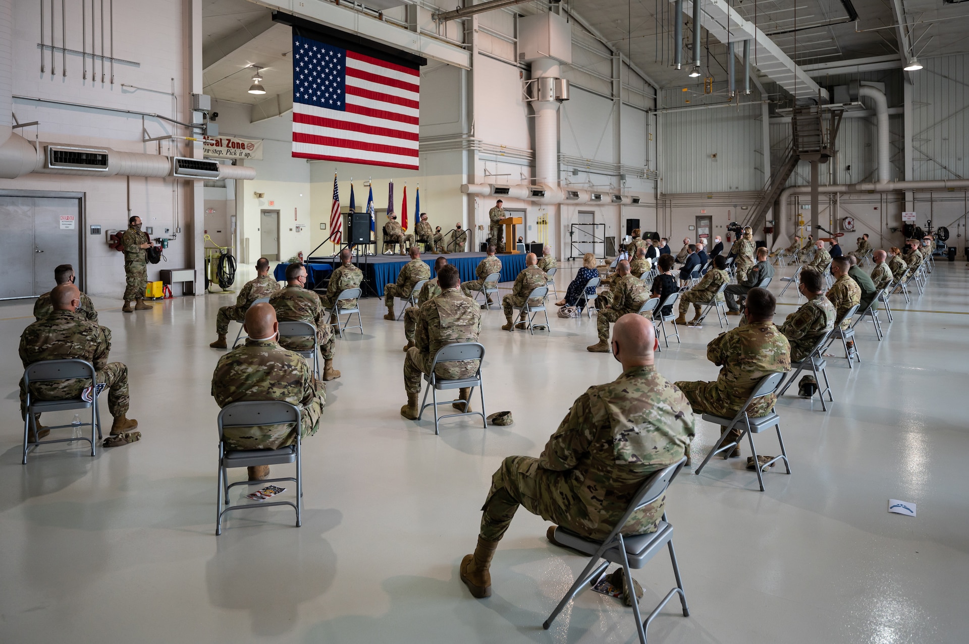 More than 50 socially distanced family, friends and fellow Airmen attend a change-of-command ceremony at the Kentucky Air National Guard Base in Louisville, Ky., Aug. 7, 2021, during which Col. Bruce Bancroft assumed leadership of the 123rd Airlift Wing. Bancroft, a command pilot with more than 3,600 hours of flight time in multiple aircraft, most recently served as commander of the 123rd Contingency Response Group here. (U.S. Air National Guard photo by Dale Greer)
