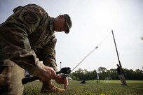Air Force Master Sgt. Joshua Buford and Dave Eure, both assigned to Joint Task Force Civil Support’s communications directorate, set up a high-frequency antenna for a communication check as part of exercise Vibrant Response 21.2.