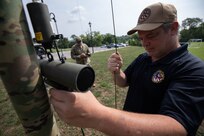 Dave Eure and Air Force Master Sgt. Joshua Buford, both assigned to Joint Task Force Civil Support’s communications directorate, set up a high-frequency antenna for a communication check as part of exercise Vibrant Response 21.2.