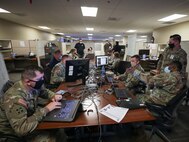 JOINT BASE LANGLEY-EUSTIS, Va. (Aug. 6, 2021) Augmentees from various Army commands collaborate in the joint operations center at Joint Task Force Civil Support (JTF-CS) headquarters during exercise Vibrant Response 21.2.