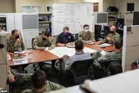 JOINT BASE LANGLEY-EUSTIS, Va. (Aug. 6, 2021) Joint Task Force Civil Support (JTF-CS) Chief of Staff Army Col. Christopher Caldwell, far right, leads an information sync meeting with staff section directors during exercise Vibrant Response 21.2.