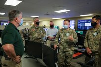 JOINT BASE LANGLEY-EUSTIS, Va. (Aug. 6, 2021) Joint Task Force Civil Support (JTF-CS) Deputy to the Commanding General Casey Collins, left, discusses JTF-CS’ mission and capabilities with Virginia National Guard Chief of the Joint Staff Army Col. Todd Hubbard, second from right, during exercise Vibrant Response 21.2.