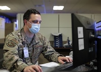 JOINT BASE LANGLEY-EUSTIS, Va. (Aug. 7, 2021) Joint Task Force Civil Support (JTF-CS) J1 Personnel Director Air Force Lt. Col. Claude Dallas tracks real and simulated forces coming into a joint operations area during notional hurricane response operations as part of exercise Vibrant Response 21.2.