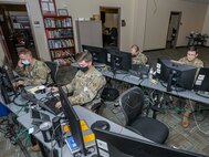 JOINT BASE LANGLEY-EUSTIS, Va. (Aug. 7, 2021) Task Force Medical, Logistics, Aviation and Operations liaison officers help coordinate response options from the joint operations center at Joint Task Force Civil Support (JTF-CS) headquarters during notional hurricane recovery efforts as part of exercise Vibrant Response 21.2.