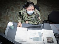 JOINT BASE LANGLEY-EUSTIS, Va. (Aug. 7, 2021) Navy Intelligence Specialist 2nd Class Maria Seagren, assigned to Joint Task Force Civil Support (JTF-CS) J2 Intelligence directorate, analyzes data to be presented to key leaders to make risk decisions in support of notional hurricane response operations during exercise Vibrant Response 21.2.
