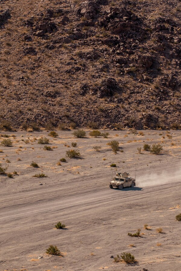 U.S. Marines with Combat Logistics Battalion (CLB) 25 conduct a Motorized Fire and Maneuver Exercise (MFME) during Integrated Training Exercise (ITX) 4-21 at Range 114 on Marine Corps Air Ground Combat Center, Twentynine Palms, California on August 3rd, 2021. The MFME challenges Marines to conduct a live-fire convoy confronted by an unblocked ambush, ensuring Marines from CLB 25 remain combat-ready as they continue to provide vital support to Marine Air Ground Task Force 25 during ITX. (U.S. Marine Corps photo by Lance Cpl. David Intriago)