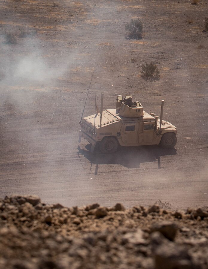 U.S. Marines with Combat Logistics Battalion (CLB) 25 conduct a Motorized Fire and Maneuver Exercise (MFME) during Integrated Training Exercise (ITX) 4-21 at Range 114 on Marine Corps Air Ground Combat Center, Twentynine Palms, California on August 3rd, 2021. The MFME challenges Marines to conduct a live-fire convoy confronted by an unblocked ambush, ensuring Marines from CLB 25 maintain combat-ready as they continue to provide vital support to Marine Air Ground Task Force 25 during ITX. (U.S. Marine Corps photo by Lance Cpl. David Intriago)