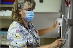 Sherry Morgan, 341st Operational Medical Readiness Squadron pharmacy technician, prepares a patient’s prescription July 14, 2021, at Malmstrom Air Force Base, Mont. In addition to active duty and dependent care, the pharmacy also serves retirees. (U.S. Air Force photo by Senior Airman Jacob M. Thompson)