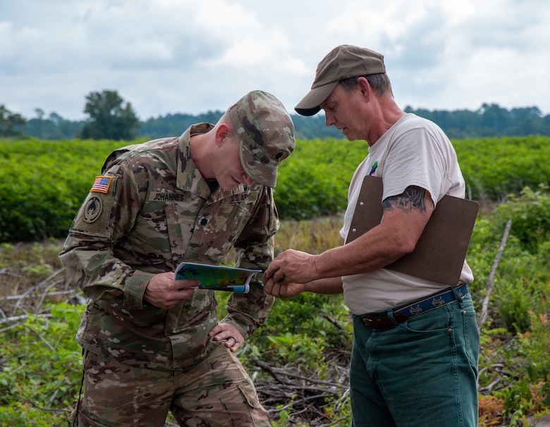 Richard Darden (right), the Regulatory Project Manager for the U.S. Army Corps Of Engineers, Charleston District, explains to Lt. Col. Andrew Johannes how to analyze soil samples during a field visit in Orangeburg, S.C.  Johannes took command of the district in July and was taking part in delineation training, designed to better educate new members of the district to what regulators do for their job.
