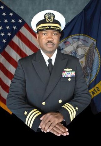 Studio portrait of Cmdr. Curtis L. Thomas, II