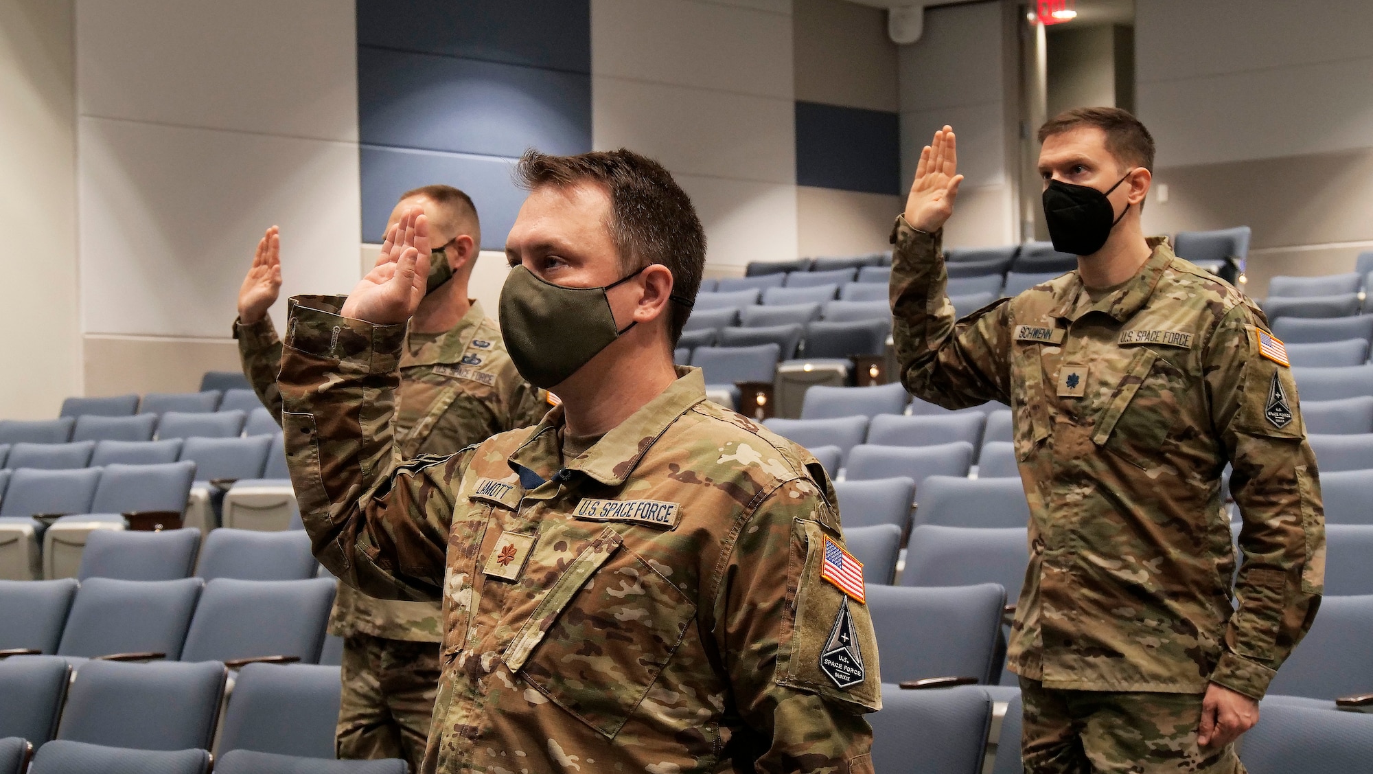 Maj. Rob Lamott from the Air Force Research Laboratory takes the oath of office with Lt. Col. Karl Schwenn from Air Force Life Cycle Management Center, ceremonially transferring from the U.S. Air Force to the U.S. Space Force in a livestreamed ceremony held Aug. 2 at Wright-Patterson Air Force Base, Ohio. (U.S. Air Force photo/Keith Lewis)