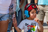 Elijah Mills waits on his father, Maj. Andrew Mills, 16th Airlift Squadron pilot, to return from his deployment at Joint Base Charleston, S.C., Aug. 8, 2021.