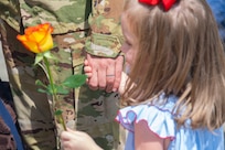 Capt. Dan Tenpas, 16th Airlift Squadron pilot, holds his daughter’s hand after returning from his deployment at Joint Base Charleston, S.C., Aug. 8, 2021.