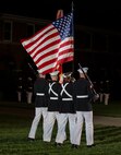 Marines with the Official Marine Corps Color Guard march across the parade deck during a Friday Evening Parade at Marine Barracks Washington, Aug. 6, 2021.
