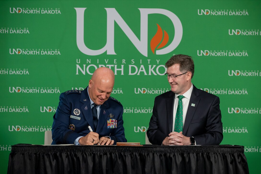 Chief of Space Operations Gen. John W. “Jay” Raymond and University of North Dakota President Andy Armacost and sign a Memorandum of Understanding Aug 9, 2021 in Robin Hall in Grand Forks, N.D. Photo by Shawna Noel Schill