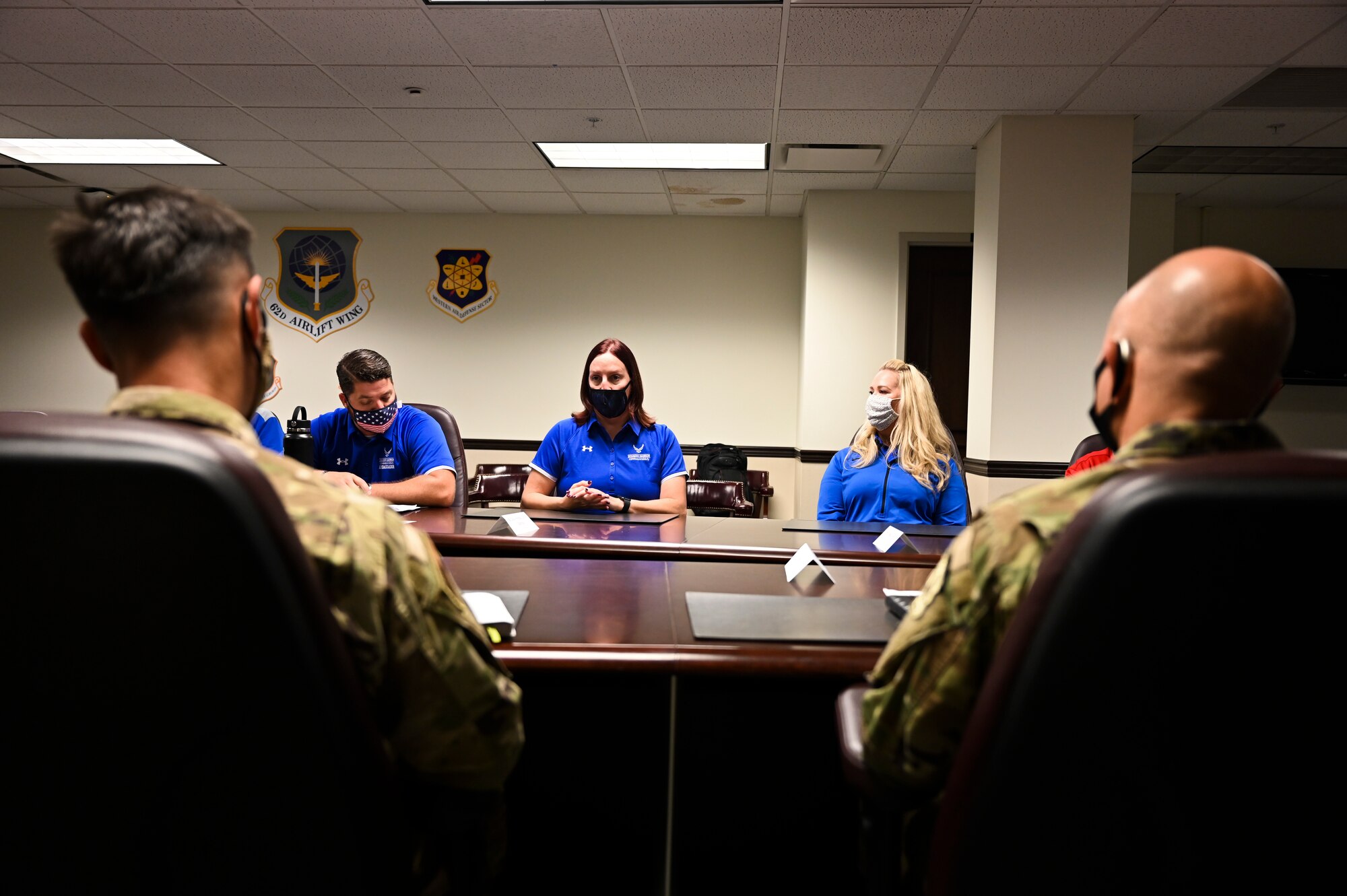 Retired U.S. Air Force Capt. Leslie Whiting (middle), Air Force Wounded Warrior Program (AFW2) ambassador, shares her stories to 62nd Airlift Wing leadership as part of the Ambassador Roadshow event at Joint Base Lewis-McChord, Wash., Aug. 9, 2021. The event provided the AFW2 team an opportunity to educate the Air Force population about support programs such as Adaptive Sports, Empowerment in Transition, Wellness & Resiliency, Airman 4 Life, Community Programs and more that help navigate the warrior’s care. (U.S. Air Force photo by Master Sgt. Julius Delos Reyes)