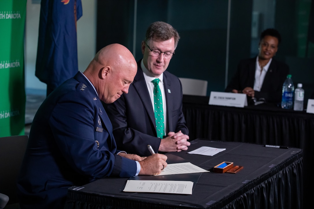 Chief of Space Operations Gen. John W. “Jay” Raymond and University of North Dakota President Andy Armacost and sign a Memorandum of Understanding Aug 9, 2021 in Robin Hall in Grand Forks, N.D. Photo by Shawna Noel Schill