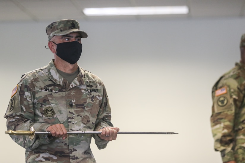 Command Sgt. Maj. Carlos O. Lopes, command sergeant major of the 377th Theater Sustainment Command, served as the custodian of the NCO sword during the 143d Sustainment Command (Expeditionary)'s Change of Responsibility ceremony held at its headquarters in Orlando, Fla.