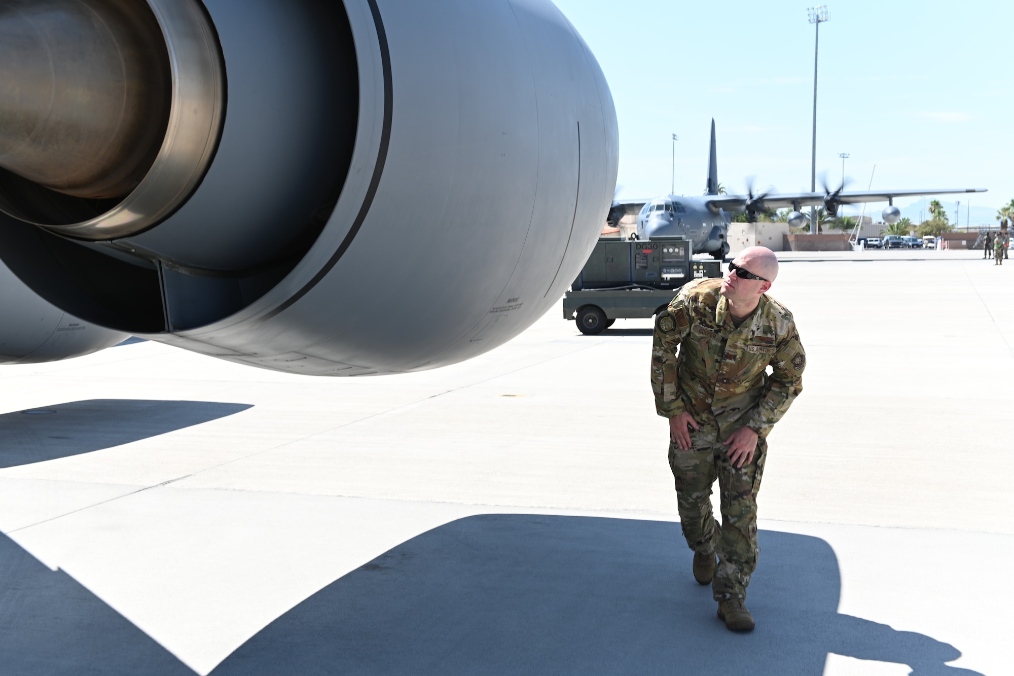 Capt. Chase Cooper, 350th Air Refueling Squadron pilot & evaluator, performs a pre-flight inspection of a KC-135 July 20, 2021, at Nellis Air Force Base, Nevada.