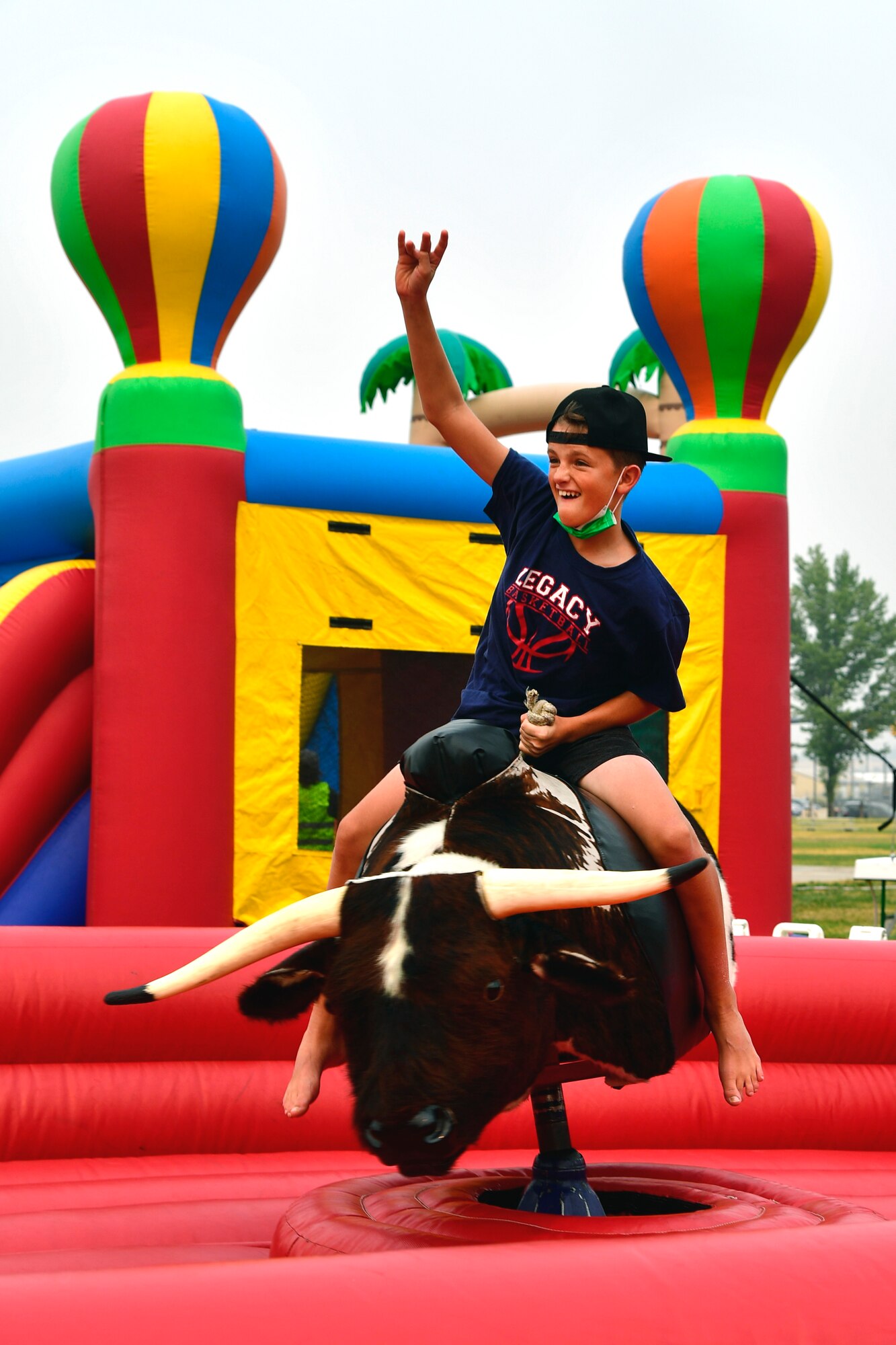 Dackson Weese takes a ride on the mechanical bull.