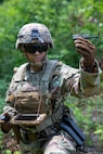 Cadet McKensey Cope, a fourth year USMA cadet selected to pilot the Soldier Borne Sensor (SBS), demonstrates the SBS to fellow cadets during the United States Military Academy (USMA) at West Point Cadet Leader Development Training (CLDT) in July.