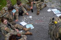 West Point Cadets conduct mission planning around a terrain model during the United States Military Academy (USMA) at West Point Cadet Leader Development Training (CLDT) in July.