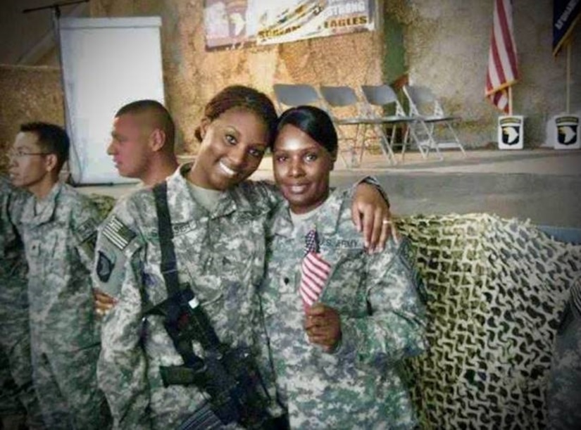 daughter hugs mother while deployed in Afghanistan