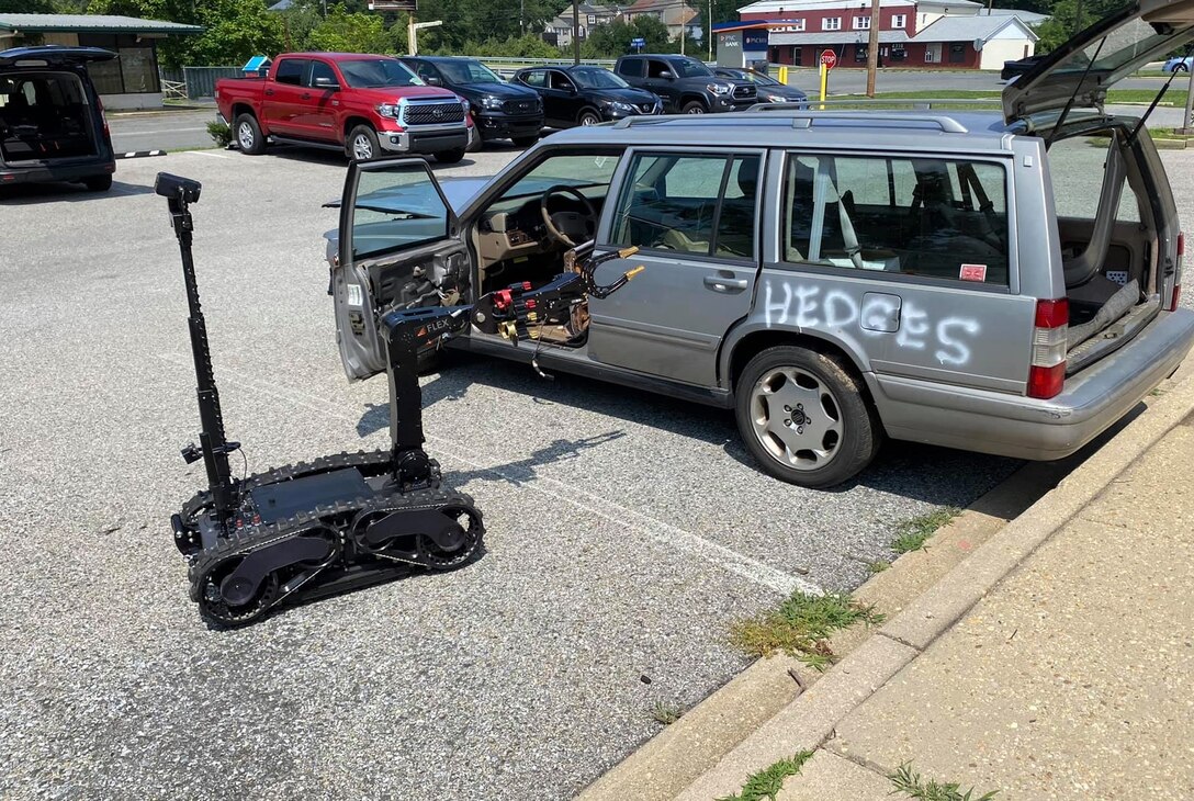 An explosive ordnance disposal robot is guided through an exercise involving bomb detection during a demonstration in Indian Head, Maryland, Aug. 2, 2021. The demonstration was part of the Eastern National Robot Rodeo and Capabilities exercise, an event the Air Force Civil Engineer Center utilizes to partner and explore future industry technologies for the explosive ordnance disposal community.