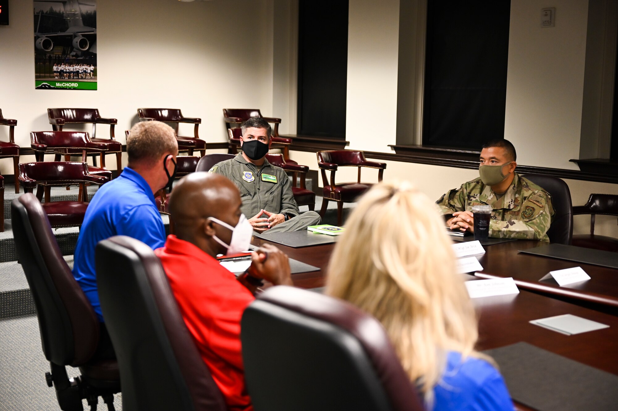 U.S. Air Force Col. David Fazenbaker, 62nd Airlift Wing commander, and Chief Master Sgt. Joseph Arce, 62nd AW command chief, listen to Air Force Wounded Warrior Program (AFW2) ambassadors and staff as part of the Ambassador Roadshow event at Joint Base Lewis-McChord, Wash., Aug. 9, 2021. The event provided the AFW2 team an opportunity to educate the Air Force population about support programs such as Adaptive Sports, Empowerment in Transition, Wellness & Resiliency, Airman 4 Life, Community Programs and more that help navigate the warrior’s care. (U.S. Air Force photo by Master Sgt. Julius Delos Reyes)