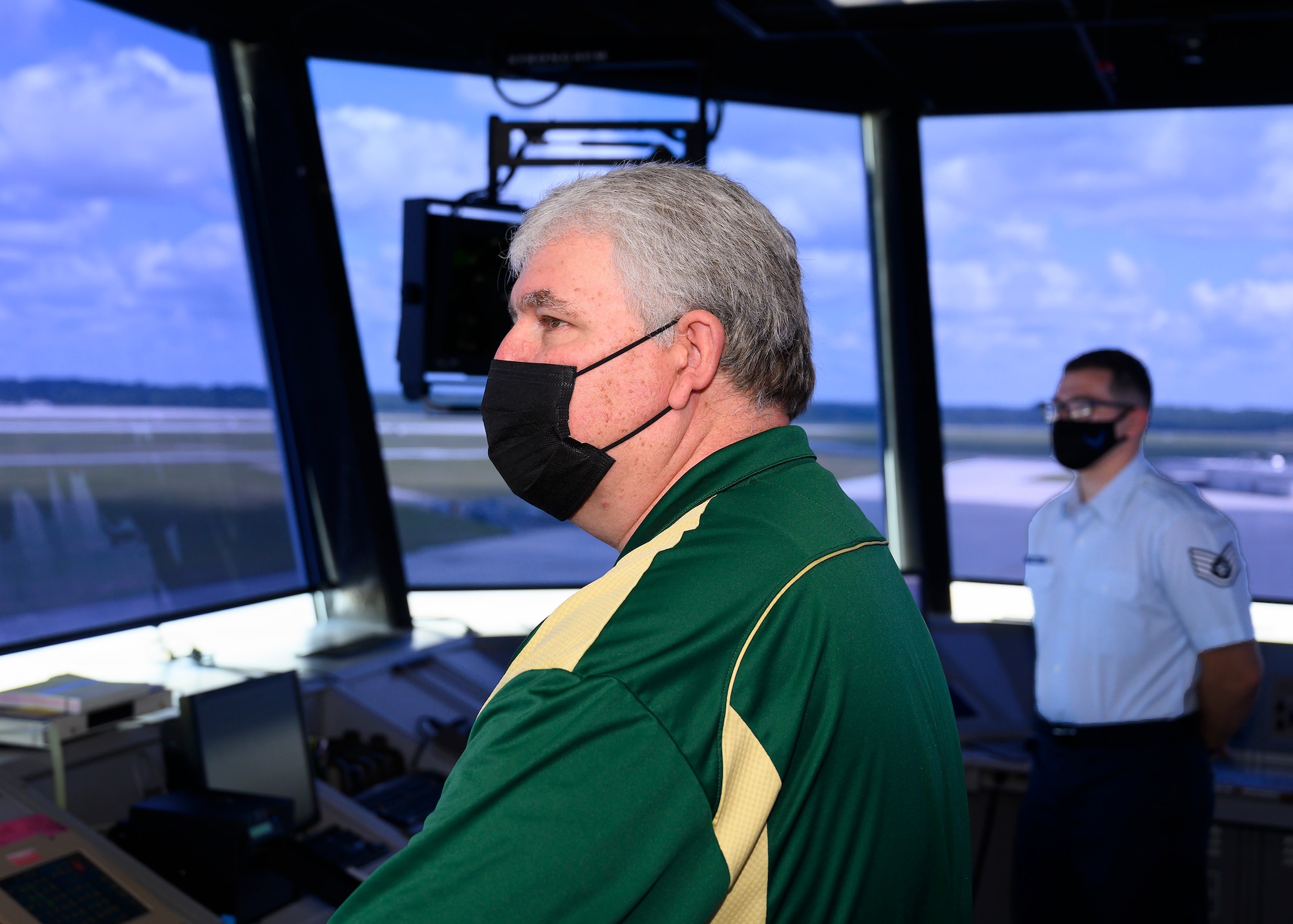 Lance Davis, 88th Operations Support Squadron air traffic control supervisor, and Staff Sgt. Tyler Downhour, air traffic controller, man the Wright-Patterson Air Force Base, Ohio, air traffic control tower on August 2, 2021. On July 17, the pair responded to a C-5 Galaxy aircraft crew declaring an emergency when it appeared they would have to make a wheels-up landing. (U.S. Air Force photo by R.J. Oriez)