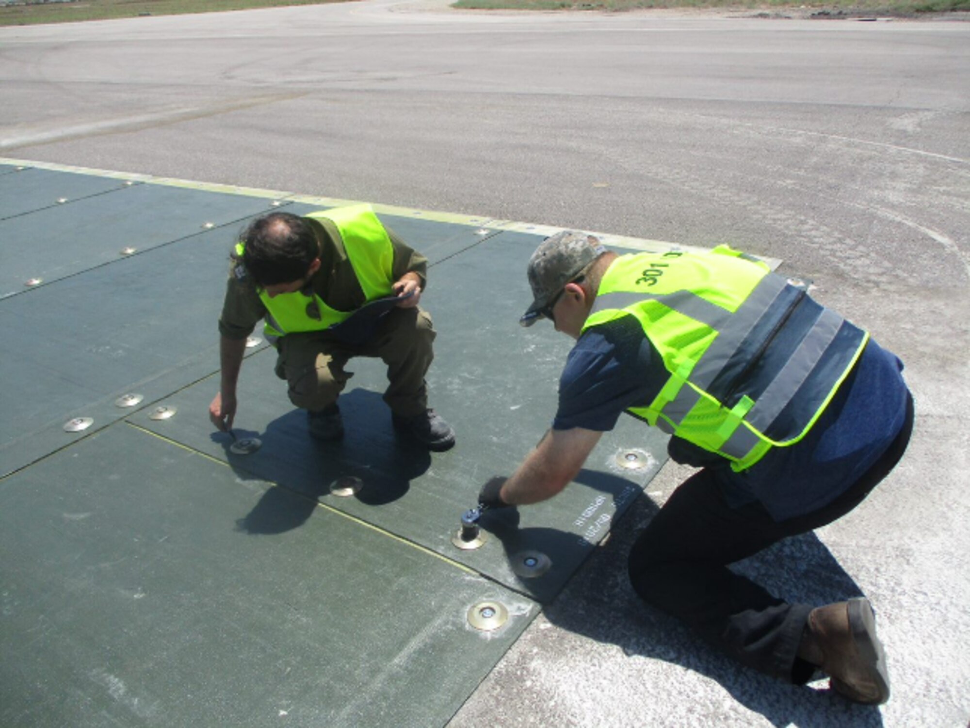 Engineers repairing a runway