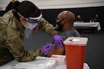 A member of team Homestead receives the COVID-19 vaccine at a vaccination event during the August Unit Training Assembly Aug. 7, 2021 at Homestead Air Reserve Base, Florida. (U.S. Air Force photo by Tech. Sgt. Allissa Landgraff)