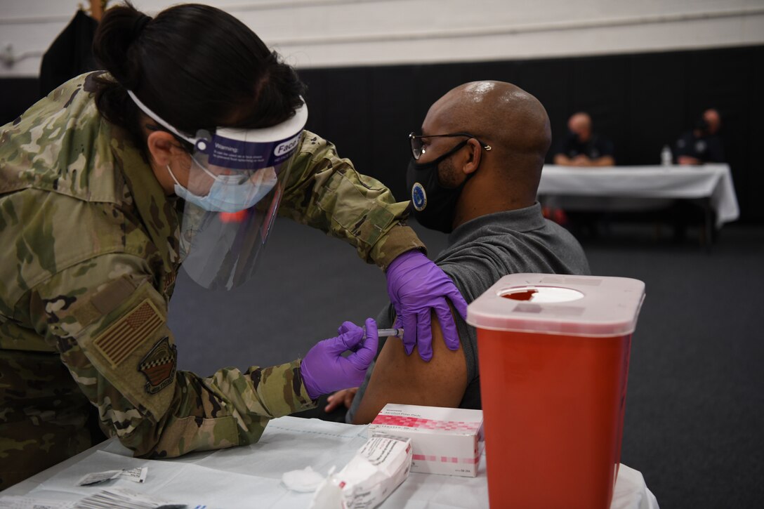 A member of team Homestead receives the COVID-19 vaccine at a vaccination event during the August Unit Training Assembly Aug. 7, 2021 at Homestead Air Reserve Base, Florida. (U.S. Air Force photo by Tech. Sgt. Allissa Landgraff)