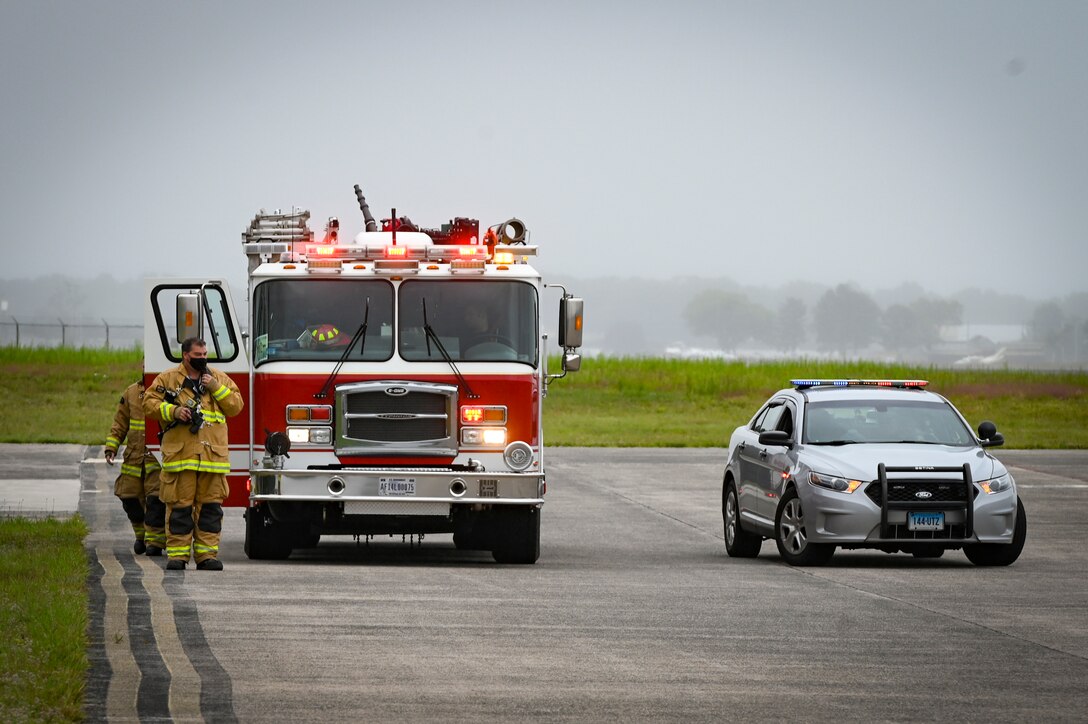 The Connecticut Air National Guard Fire Department and Connecticut State Police respond to a small unmanned aircraft system flying over Bradley Air National Guard Base during a drone response exercise conducted at the installation in East Granby, Connecticut, Aug. 5, 2021.  With the increased prevalence of drone activity around the world, the 103rd Security Forces Squadron partnered with the Transportation Security Administration and Connecticut State Police to conduct a multi-agency antiterrorism exercise that tested the base’s response to a drone incursion. (U.S. Air National Guard photo by Tech. Sgt. Steven Tucker)