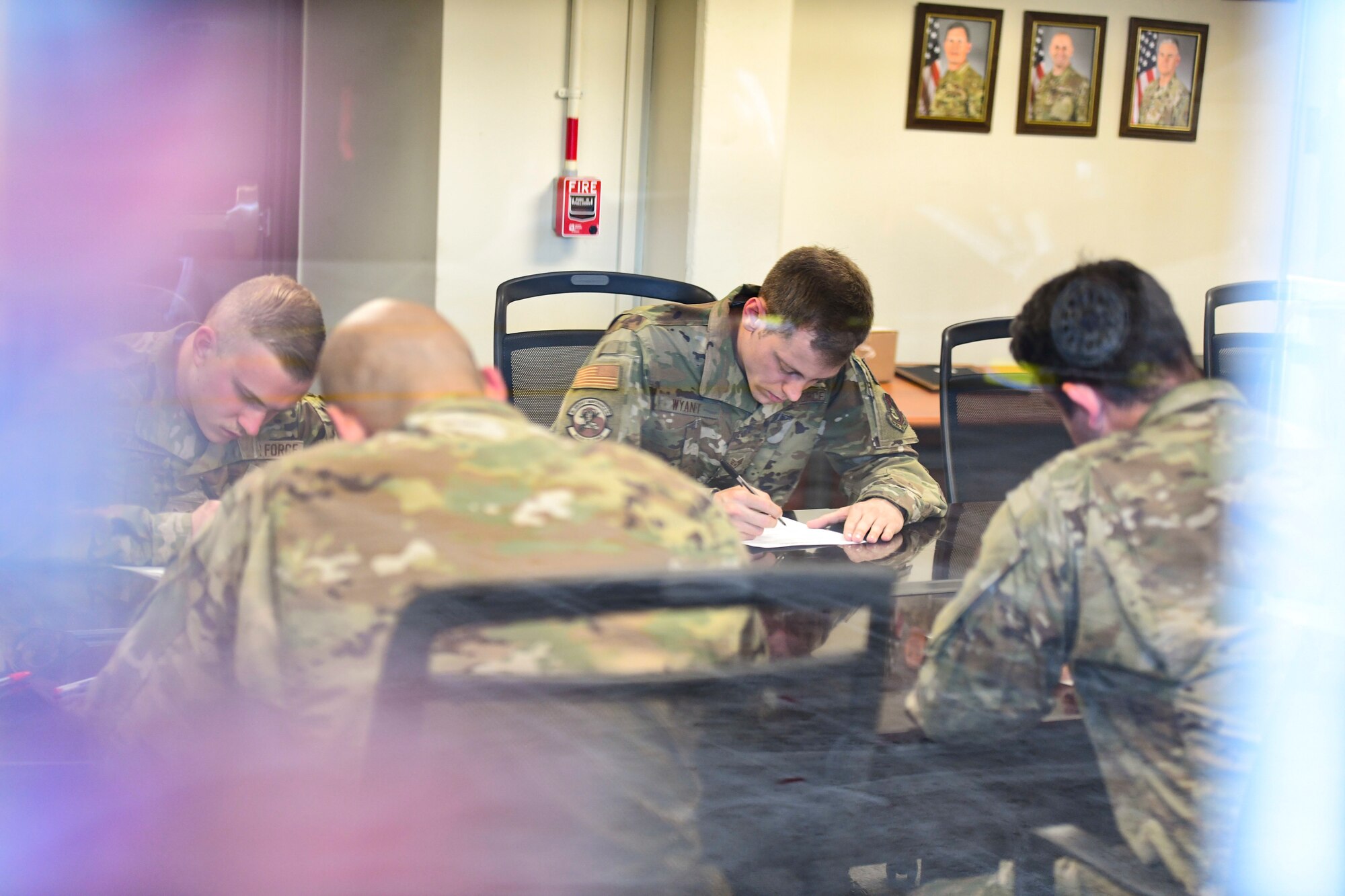 Airmen finish a test.