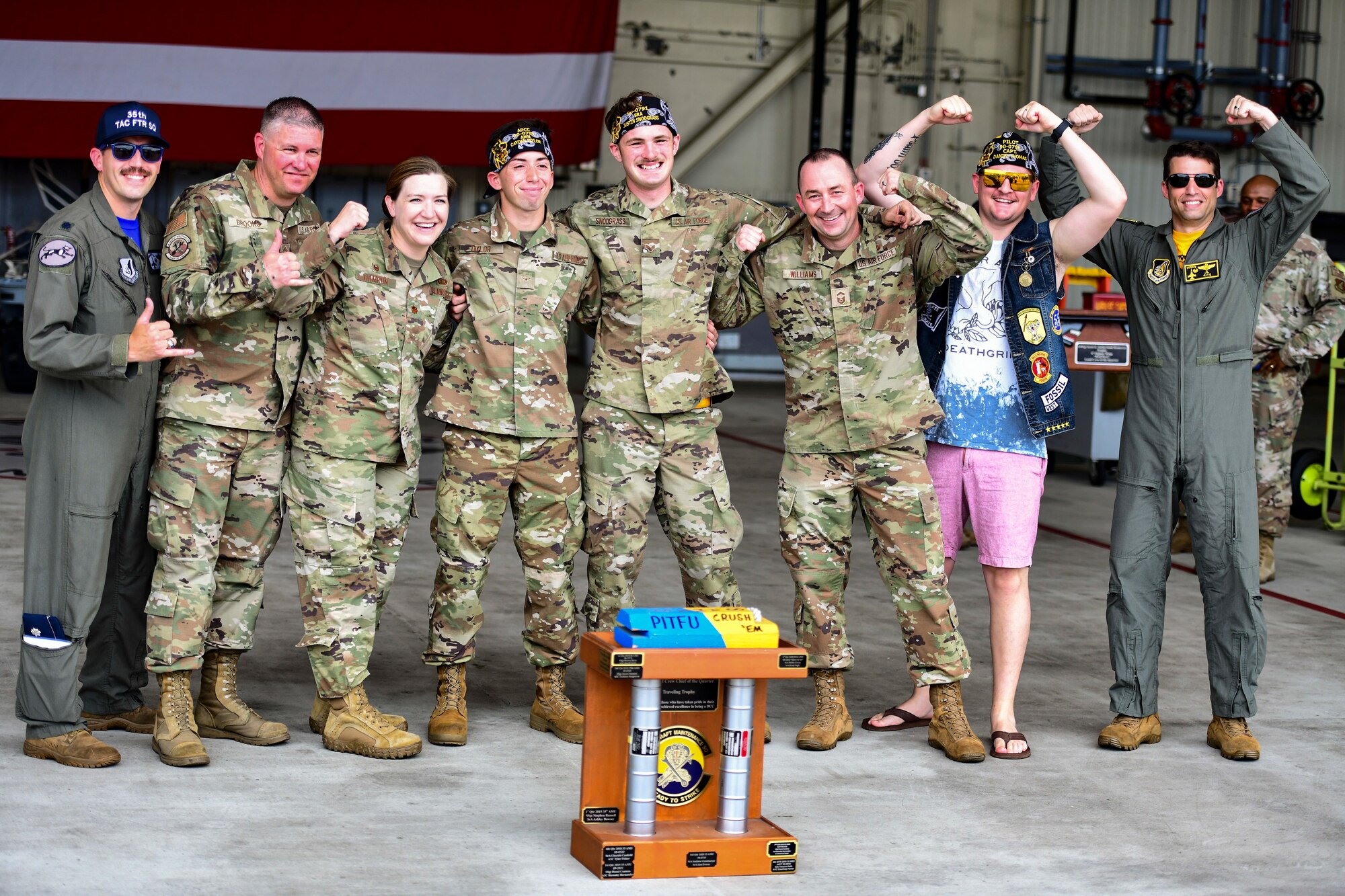 Airmen pose for a photo.