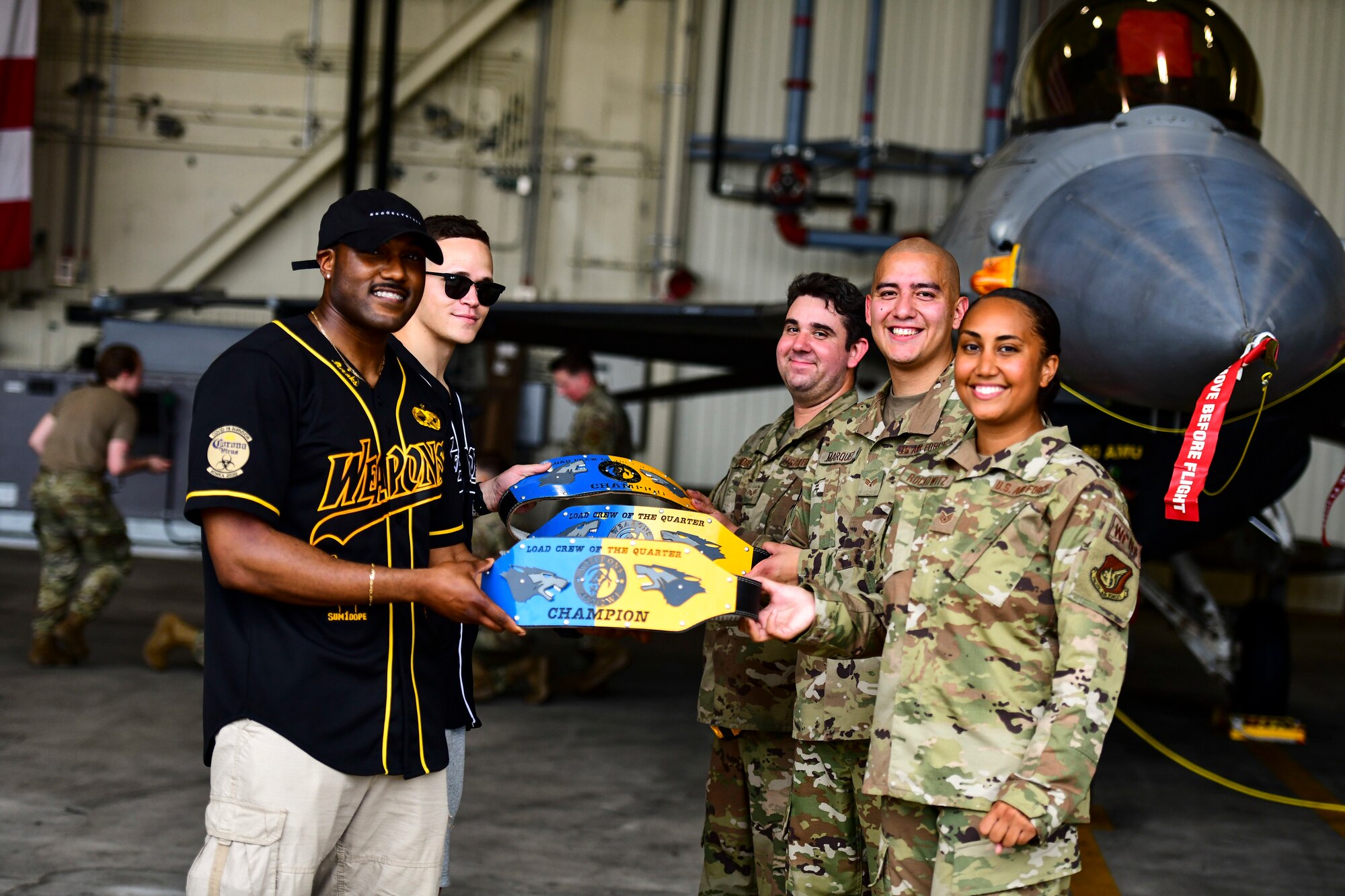 Airmen pose for a photo.