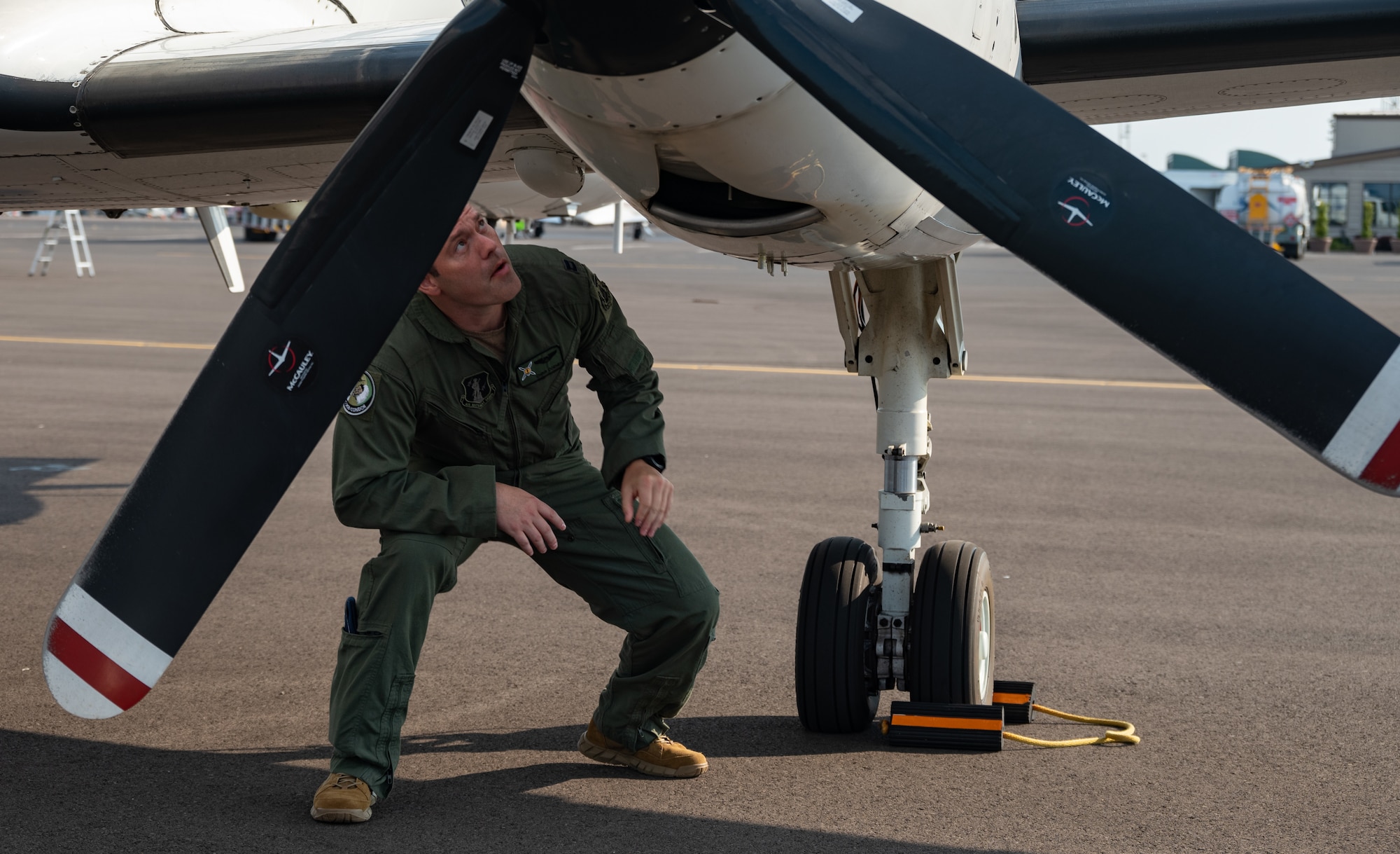 Capt. Chris Coenen, 187th Fighter Wing, Alabama Air National Guard, RC-26B pilot, performs a preflight check of the U.S. Air Force RC-26B Metroliner aircraft prior to departing for a wildland fire mapping and detection mission in support of the U.S. Forest Service at the Eugene Airport, Eugene, Ore., August 1, 2021.