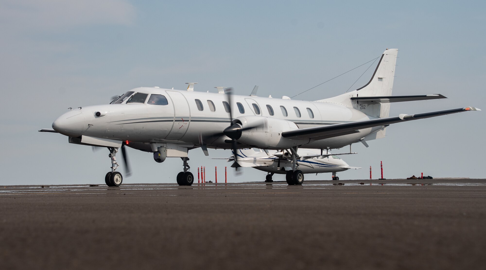 A U.S. Air Force RC-26B Metroliner aircraft assigned to the 162nd Fighter Wing, Arizona Air National Guard, sits on the flight line prior to departing on a wildland fire mapping and detection mission in support of the U.S. Forest Service at the Eugene Airport, Eugene, Ore., August 1, 2021.