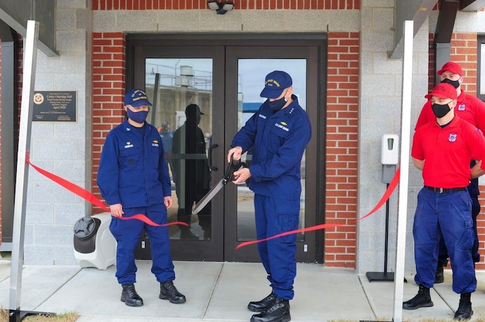 Vice Adm. Michael McAllister, Deputy Commandant for Mission Support and Vice Adm. Steven Poulin, commander Atlantic Area, participate in ribbon cutting ceremony for Crotty-Ethridge Hall March 23, 2021 in Yorktown, Virginia. U.S. Coast Guard photo.