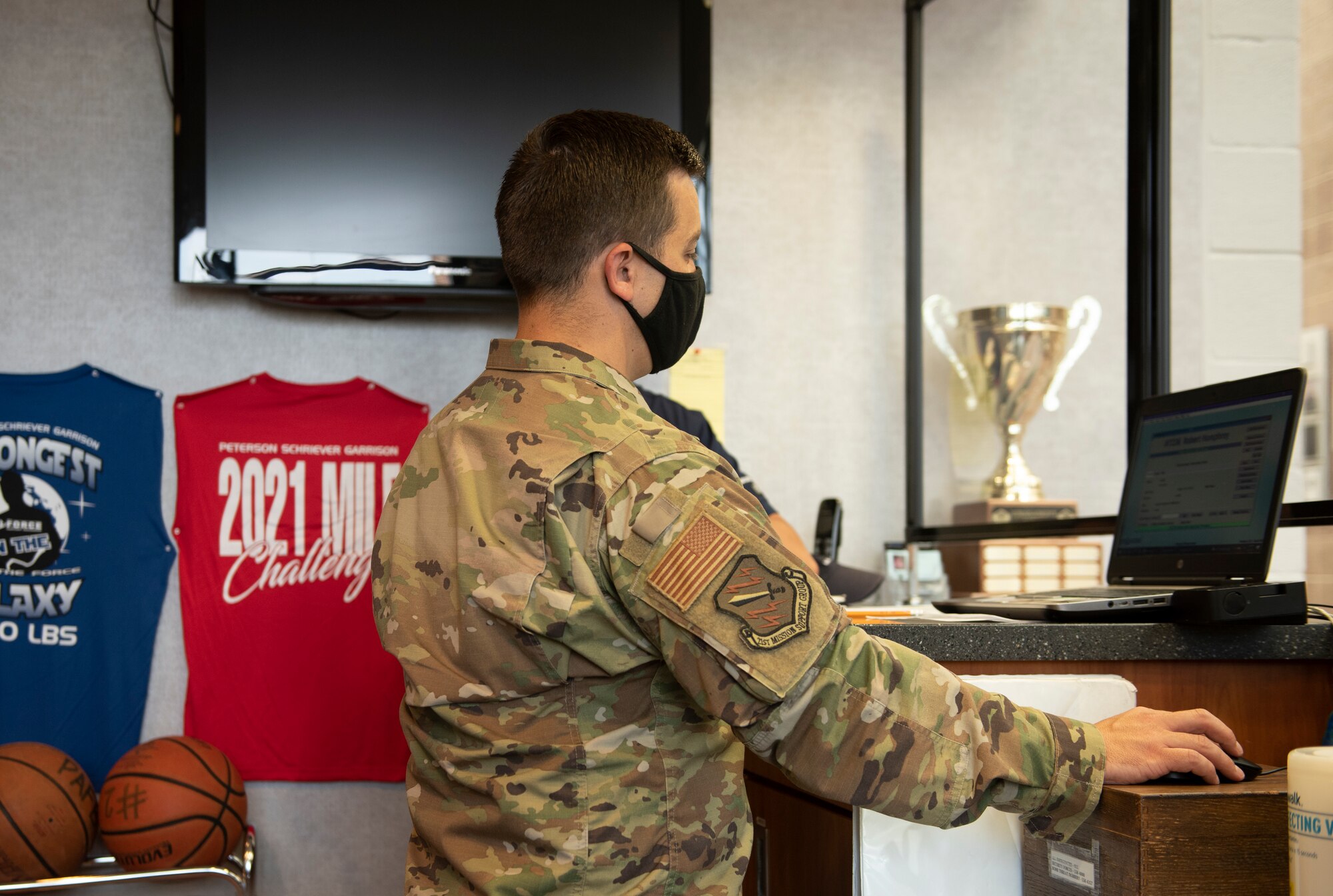 21st MSG commander learns how to sign guests into the fitness center system