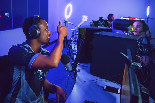Tech. Sgt. Maurice Moyer, team captain for the Department of the Air Force Gaming Space Force team, gives a thumbs up to one of his teammates during a DAFG Season 1 tournament. Air Force launched the gaming league in 2020 to foster resiliency and retention through global e-sports events that bring Airmen and Guardians together in competitive leagues.