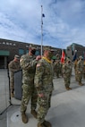 Brig. Gen. Charles “Lee” Knowles, commander of the Alaska Army National Guard, presents Col. Matthew Schell, outgoing commander of the 297th Regional Support Group, with the Alaska Legion of Merit recognizing his accomplishments while serving concurrent assignments as the brigade commander and full-time AKARNG deputy chief of staff for operations during a change of command ceremony at the Lestenkof Plaza on Joint Base Elmendorf-Richardson, Alaska, August 7, 2021. (U.S. Army photo by Sgt. Heidi Kroll)