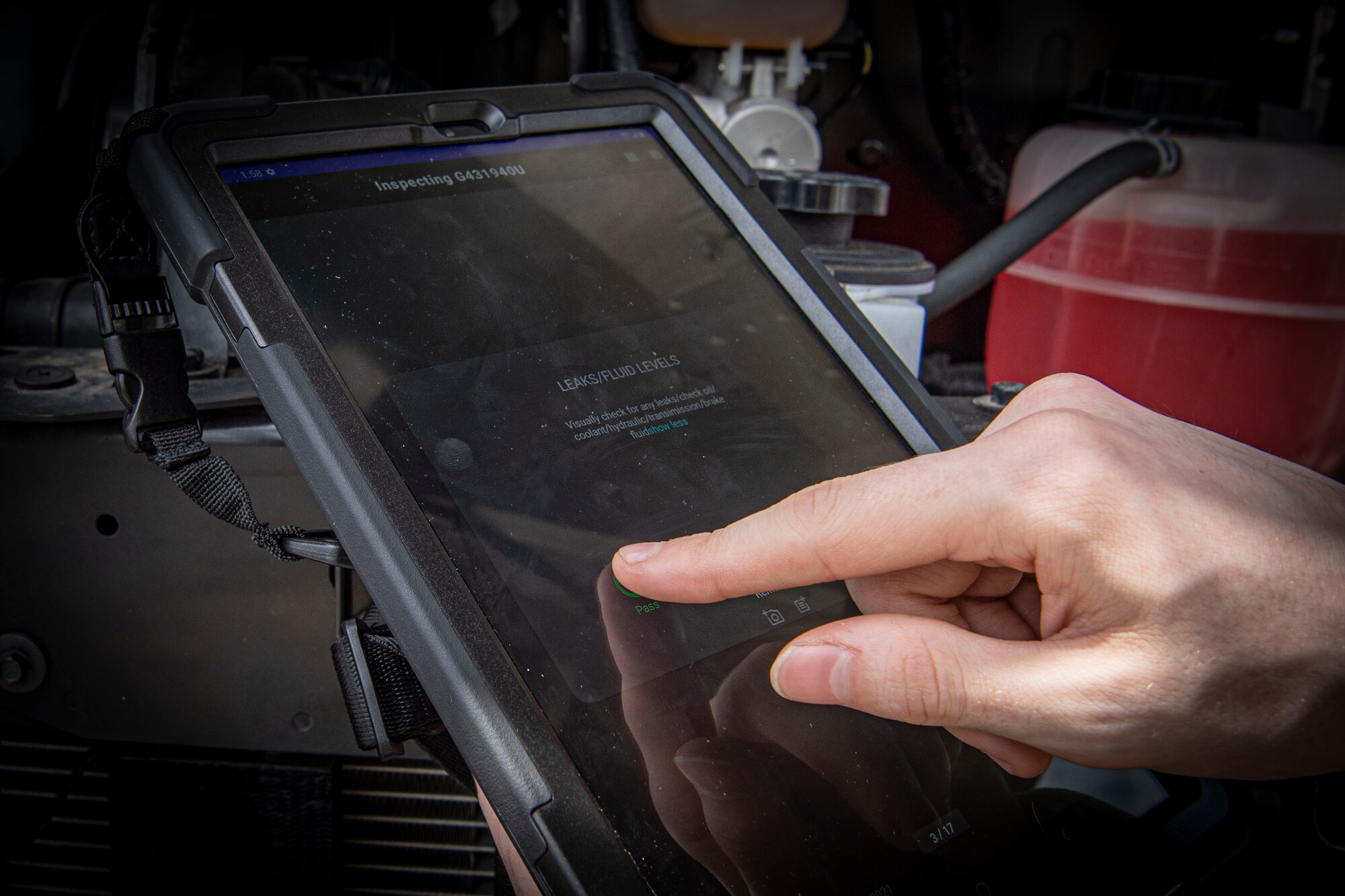 Photo of an Airman using the Real-time Hybrid Internet of Things Networked Operations (RHINO) application.