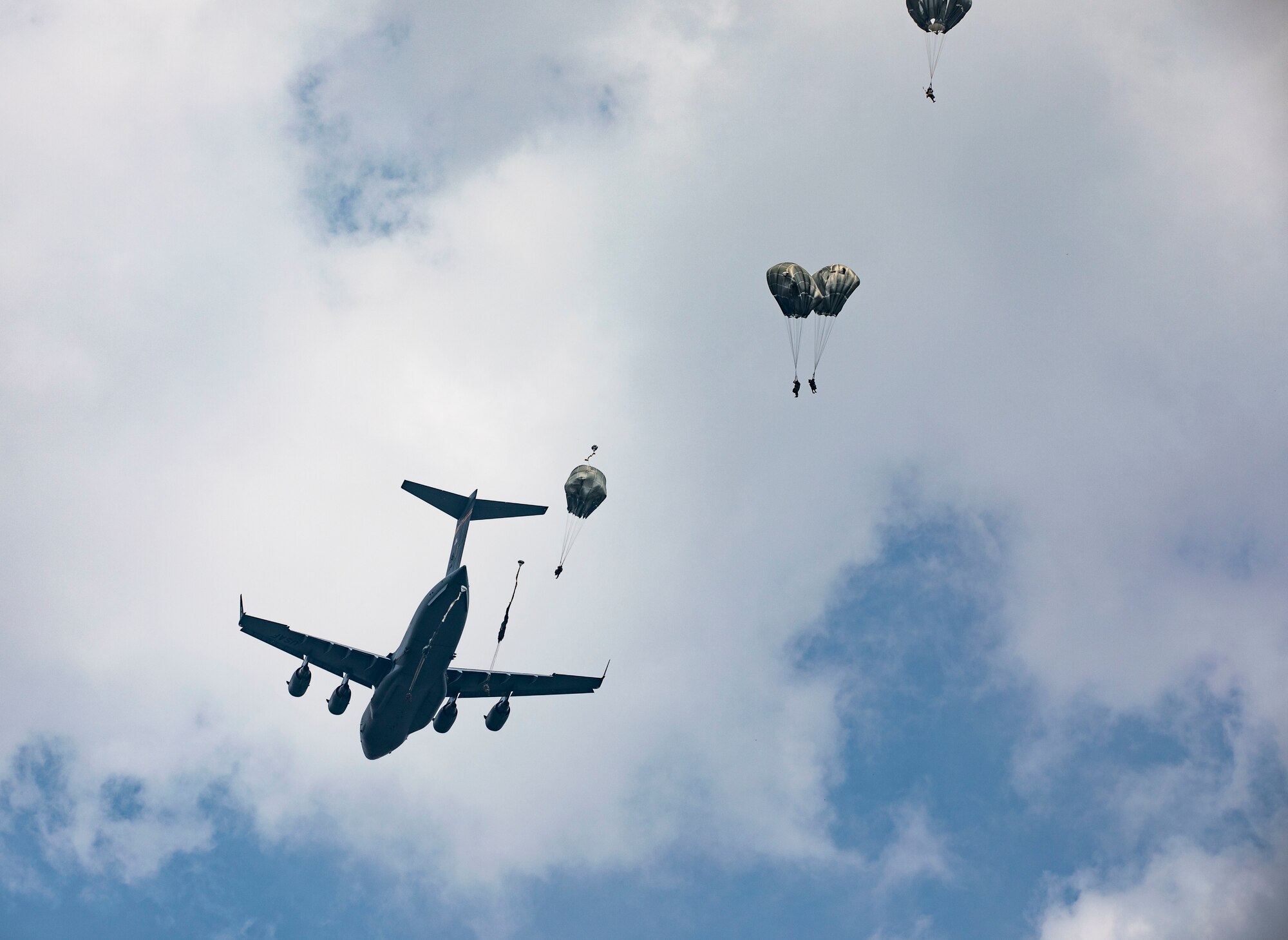 Paratroopers jumping out of a plane.