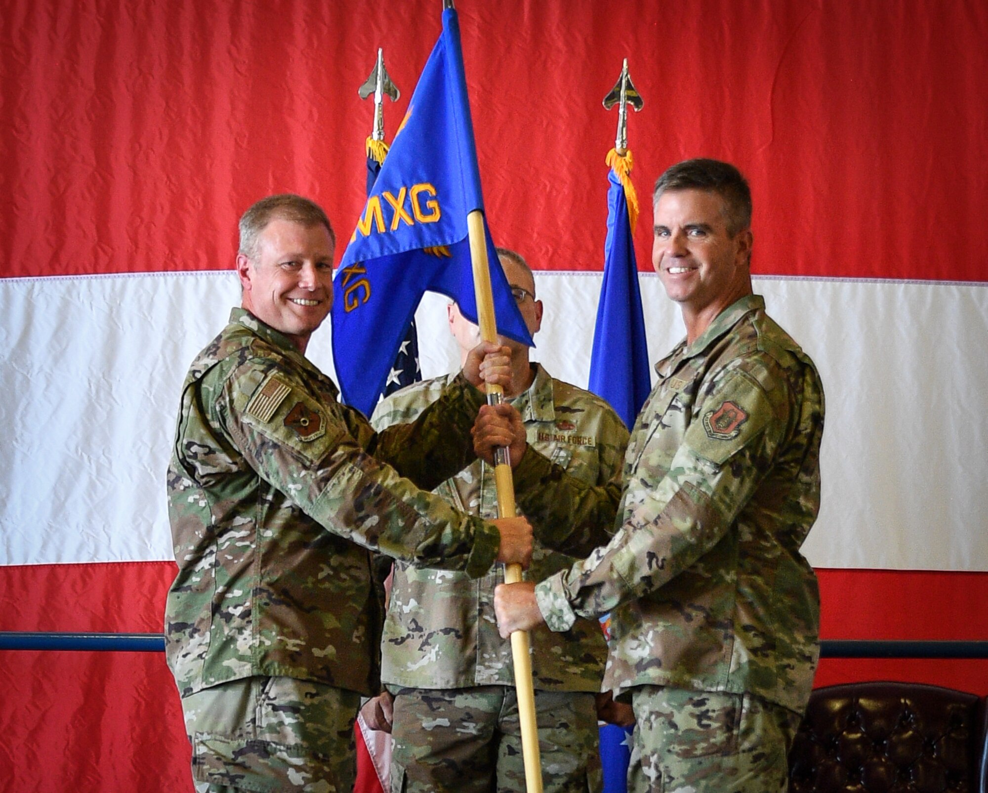(left) Col. Allen Duckworth, 301st Fighter Wing commander, passes the 301 FW Maintenance Group guideon to Col. John Nemecek, the incoming 301 FW MXG commander, August 8, 2021, during at change of command ceremony at U.S. Naval Air Station Joint Reserve Base Fort Worth, Texas. One of Nemecek’s main areas of focus will be leading 301 FW maintenance Airmen through the wing’s transitions from an F-16 Fighting Falcon unit to Air Force Reserve Command’s first F-35A Lightning II unit. (U.S. Air Force photo by Master Sgt. Jeremy Roman)