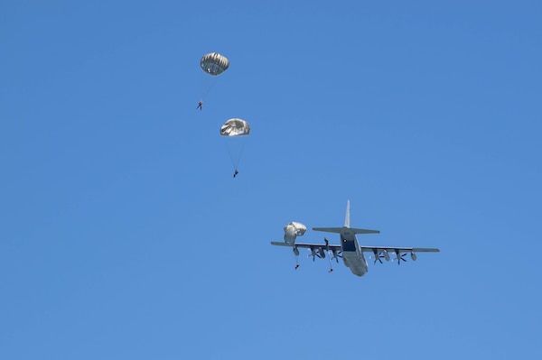 Explosive Ordnance Disposal Technicians, assigned to Explosive Ordnance Disposal Mobile Unit (EODMU) 1, jump from a KC-130 aircraft.