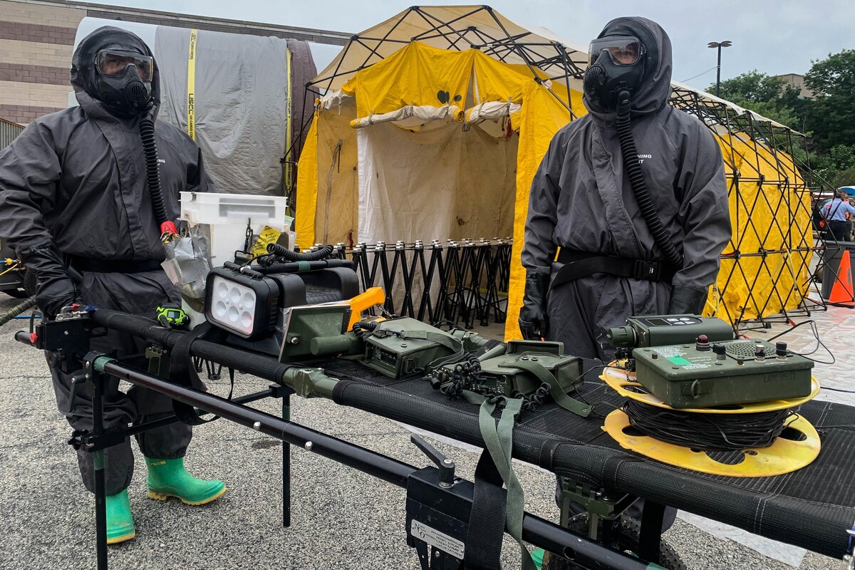 People operate in hazardous response suits.