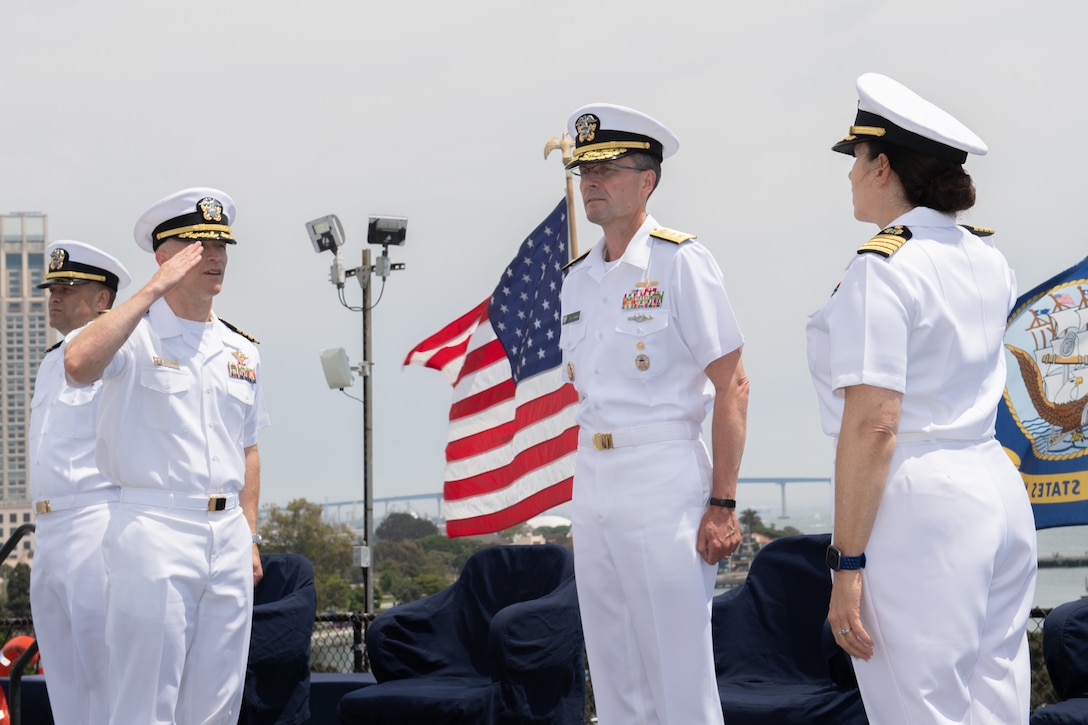 Capt. Joshua Nauman, left, relieves Capt. Jennie Goldsmith as commanding officer.