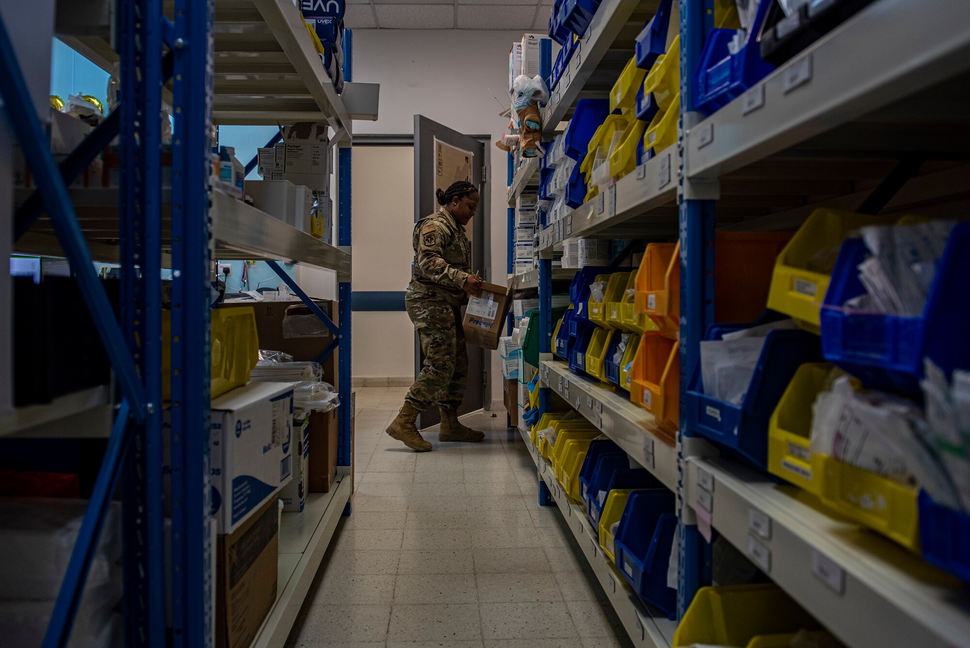 Tech. Sgt. Aleeda Reagan, 379th Expeditionary Medical Support Squadron customer service noncommissioned officer in charge, restocks a medical treatment facility with clinical supplies Aug. 3, 2021, at Al Udeid Air Base, Qatar.